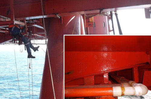 Pipe repairs on underside of offshore platform.